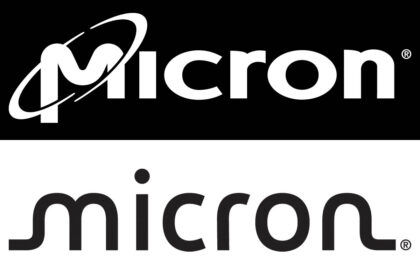 Linus Sebastian from Linus Tech Tips standing with a Micron engineer in a cleanroom, examining a silicon wafer during the Micron factory tour.
