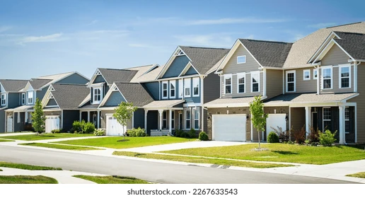 A row of suburban houses with one house faded into a shadow, representing shadow inventory